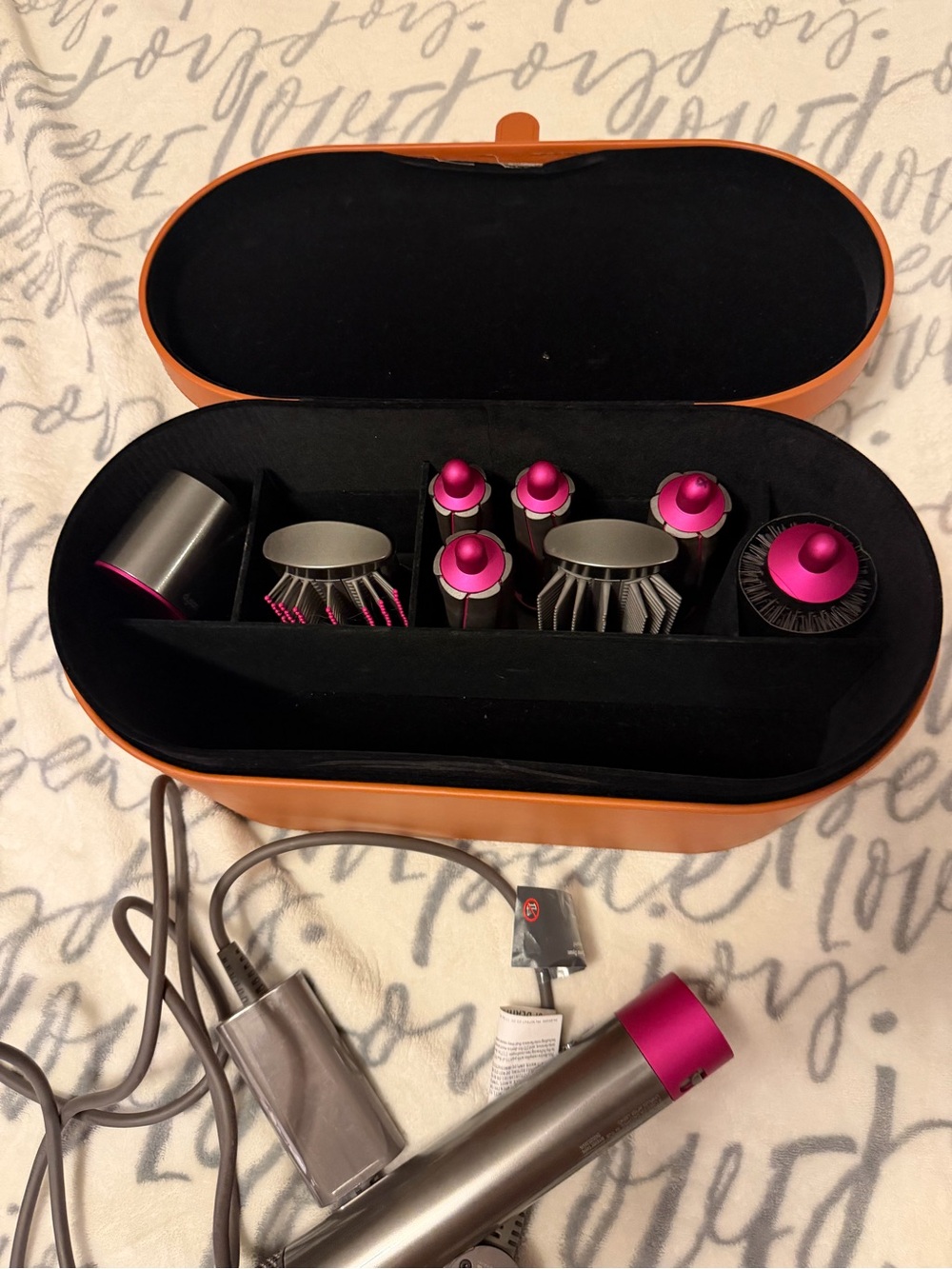 Dyson hair styler set in pink and orange case
